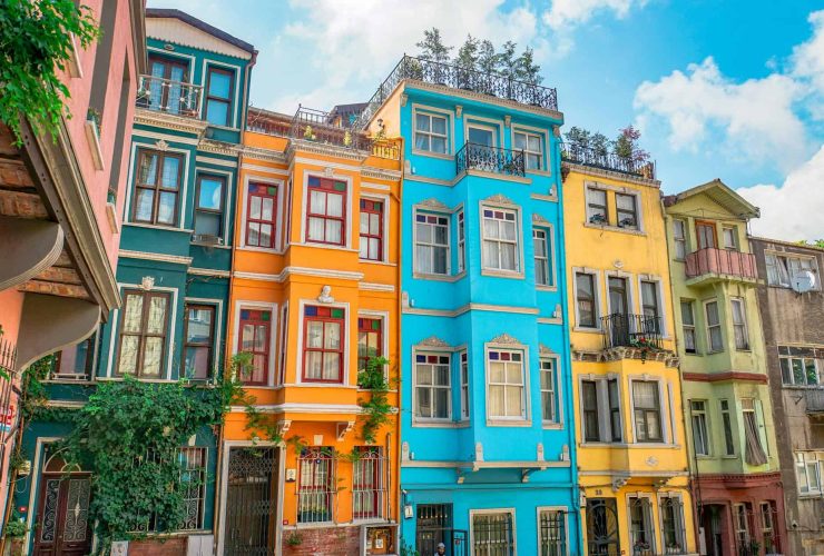 a colorful buildings under the blue sky and white clouds